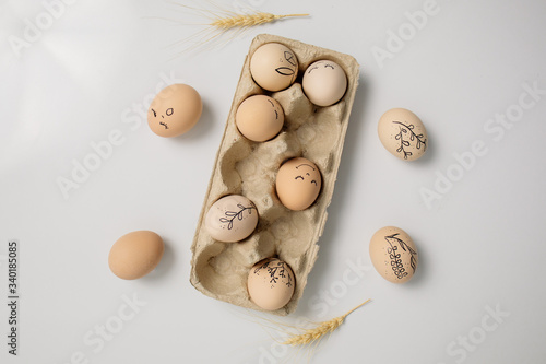 Easter eggs and easter bunny on white background with copy space. Easter background. Top view