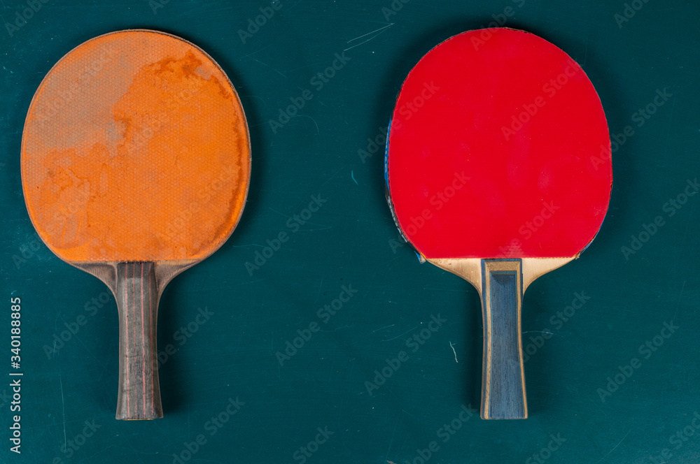 Ping pong table, rackets and balls in a sport hall. Table tennis sport concept Ping pong table, rackets and balls in a sport hall. Table tennis sport concept