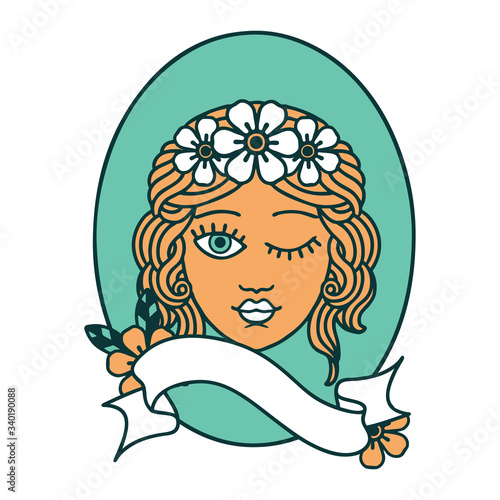 tattoo with banner of a maiden with crown of flowers winking