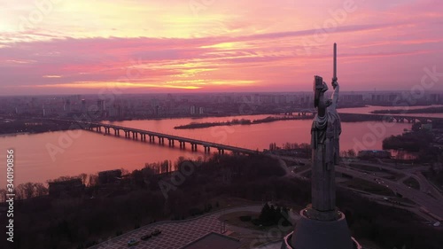 Drone video. Monument of Motherland Mother in Kiev. Ukraine. Devoted to the Wold War II. Red dawn city view. 