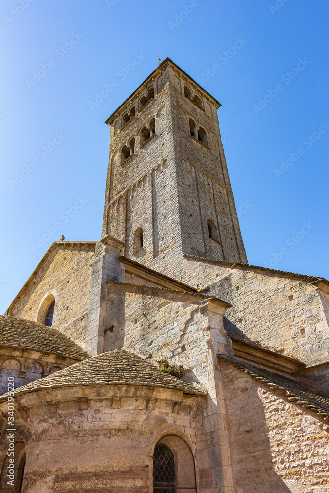 View of the bell tower and apses of the Romanesque church of Chapaize, France