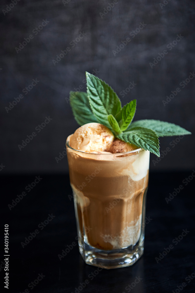 Glass of latte with vanila ice cream and mint Glass of latte with vanila ice cream and mint