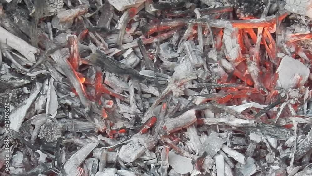 Fiery colourful hot glowing smoking embers of fire charcoal bonfire Fiery colourful hot glowing smoking embers of fire charcoal bonfire