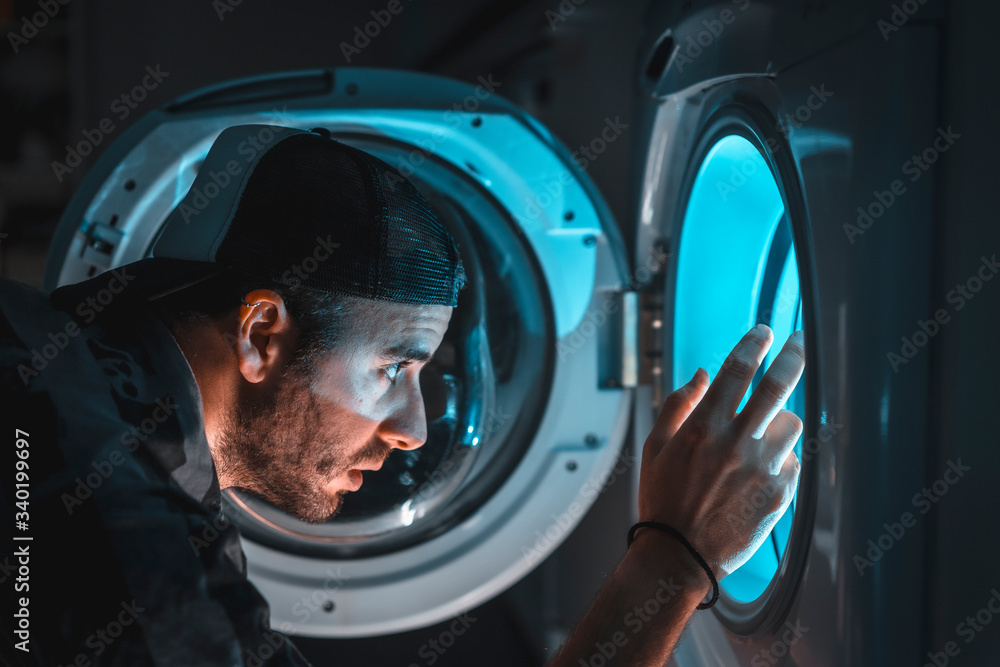 A young man in a brave cap facing his nightmares. spaceship simulation A young man in a brave cap facing his nightmares. spaceship simulation