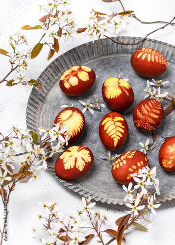 Wallpaper Mural Homemade Easter eggs in a rustic metal plate with wild white flowers of serviceberry tree. (Amelanchier). Selective focus. Torontodigital.ca