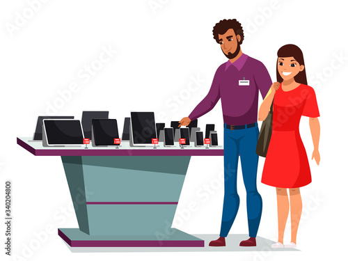 Woman choosing digital gadget in electronic store