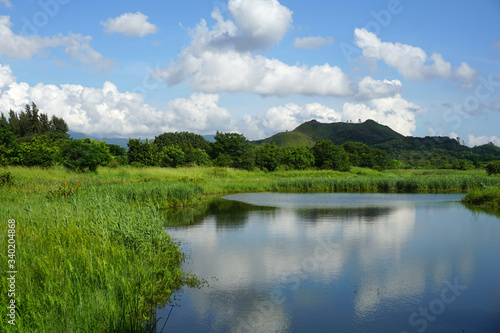 scenic view of lake and the mountains, Hong Kong Wetland Park