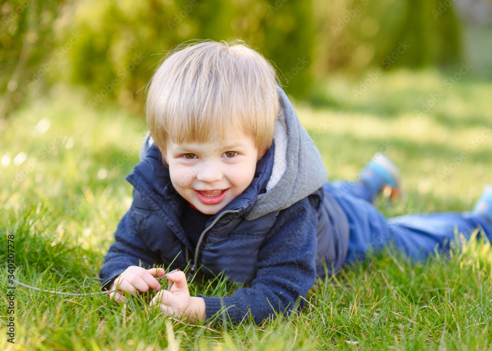 portrait of little model boy in nature portrait of little model boy in nature