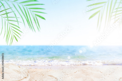 Sand with blurred Palm and tropical beach bokeh background  Summer vacation and travel concept. Copy space