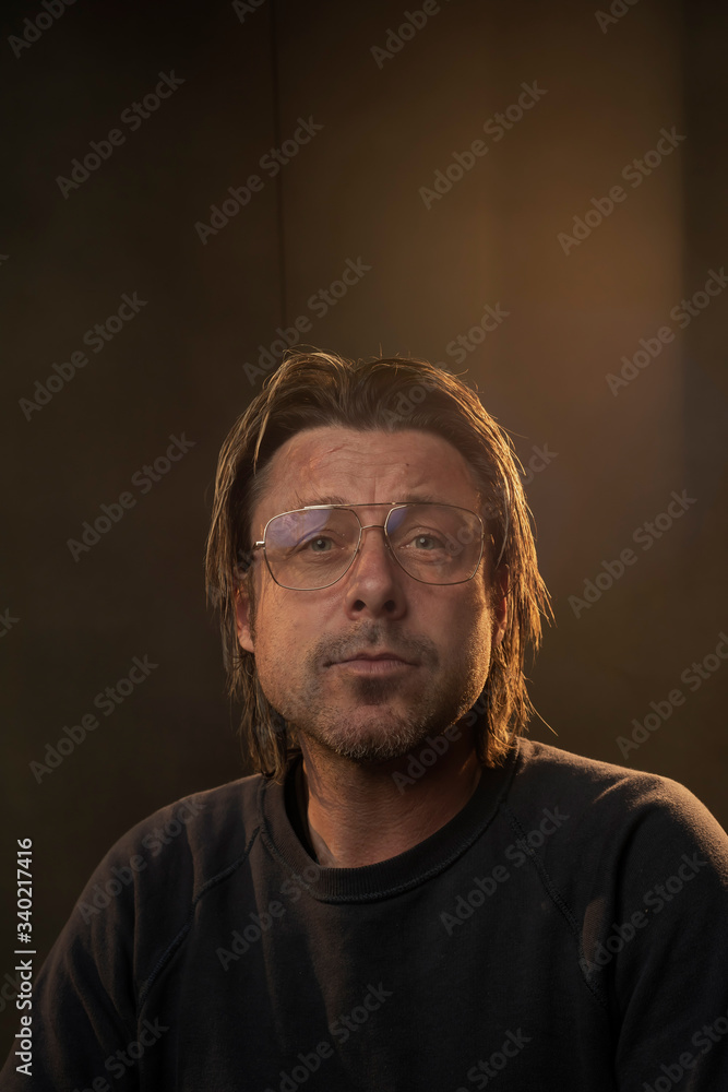 Studio portrait of a man in retro eyeglasses. Studio portrait of a man in retro eyeglasses.