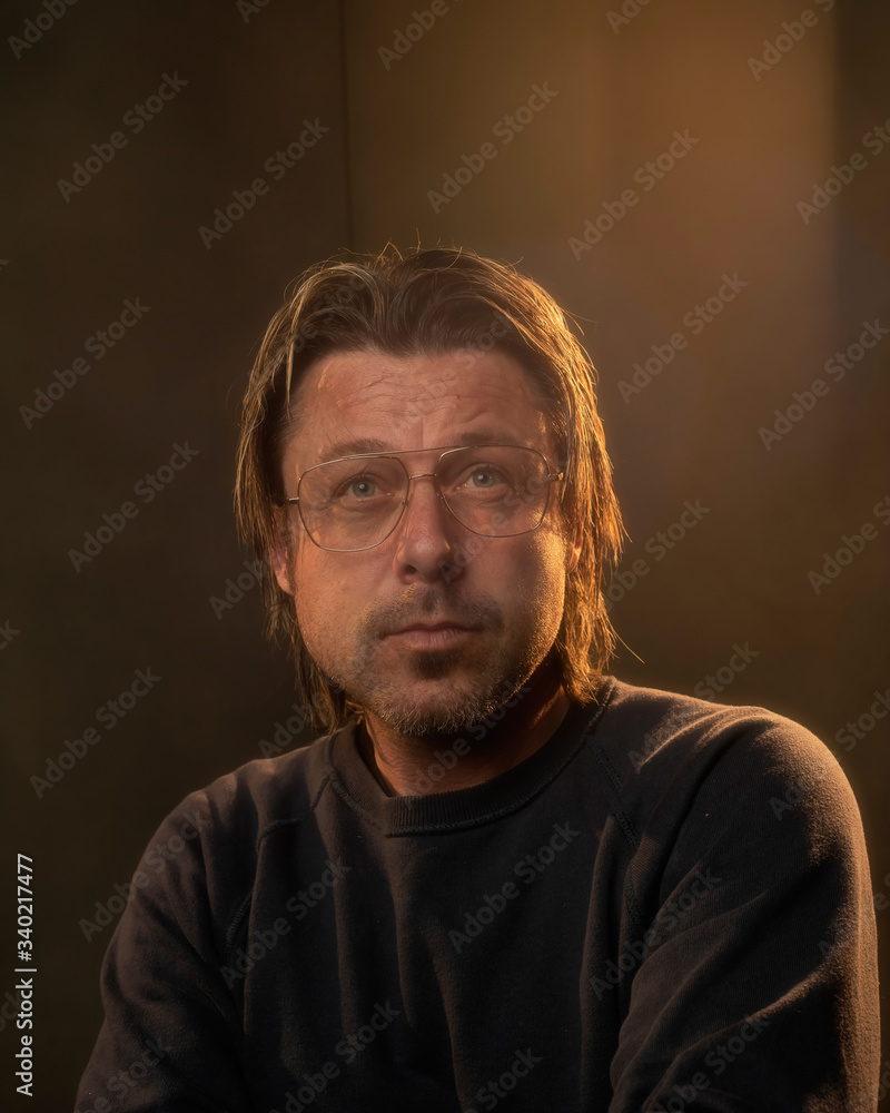 Studio portrait of a man in retro eyeglasses. Studio portrait of a man in retro eyeglasses.