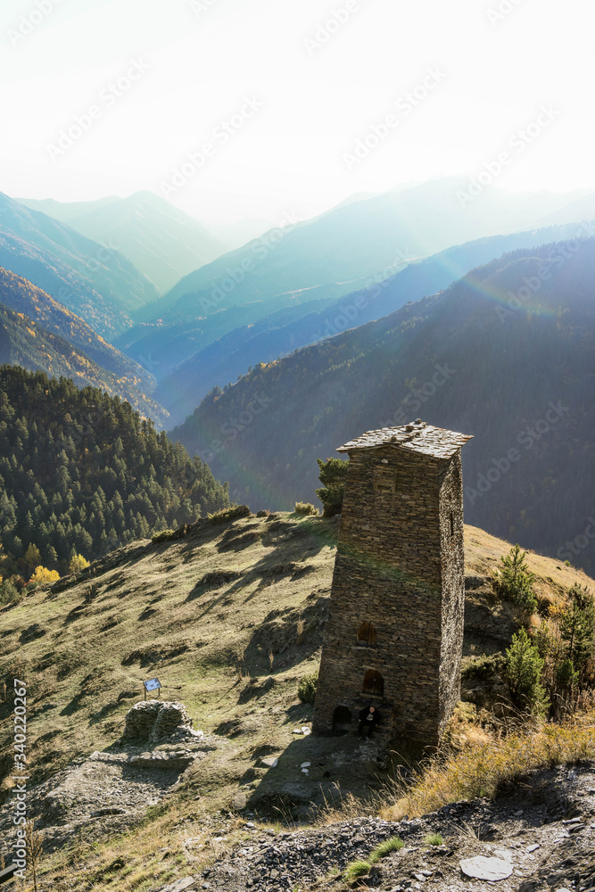 A tower of the old fort of upper Omalo overlooks the mountainous landscape A tower of the old fort of upper Omalo overlooks the mountainous landscape