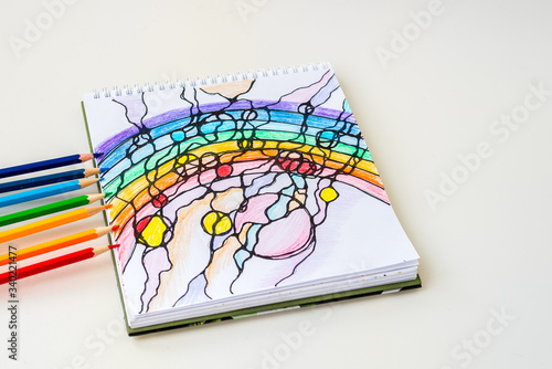 The neurographic rainbow is drawn with colored pencils on a white sheet of paper.