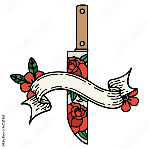 tattoo with banner of a dagger and flowers