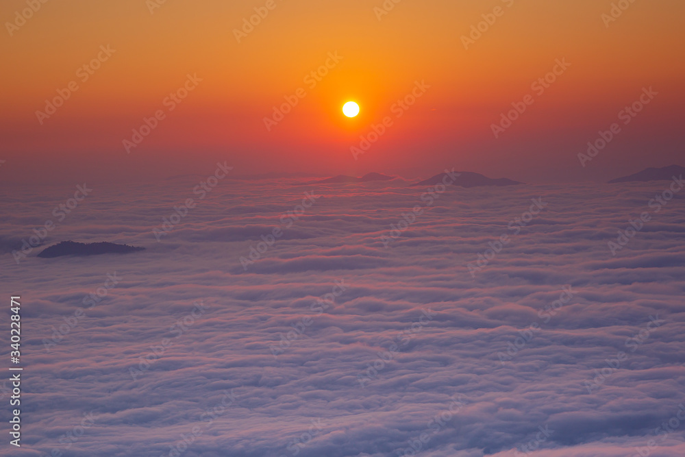 Fototapeta premium Panoramic view Sunrise and mist on mountain view at the north of thailand,Sunrise at Phu chee dao peak of mountain in Chiang rai, Thailand. 