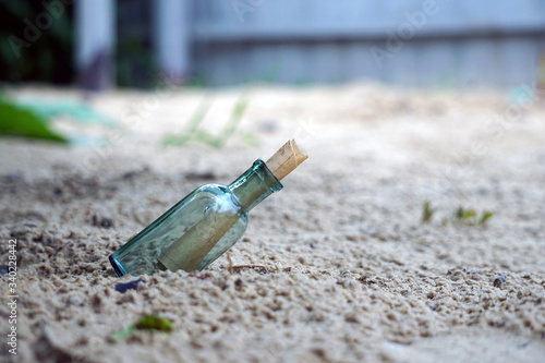 bottle with a note on the shore