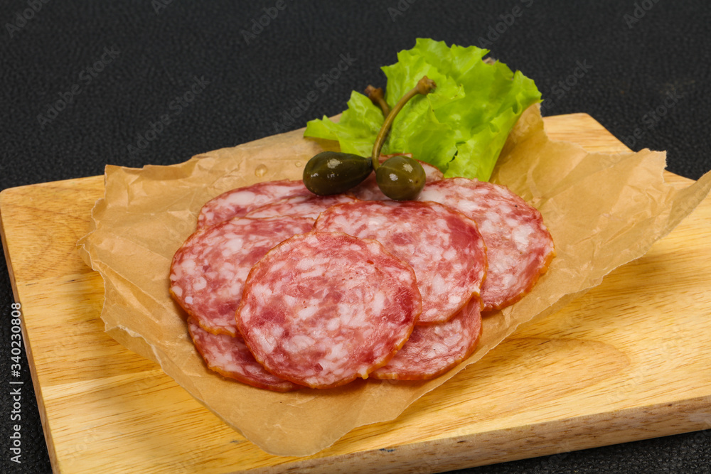 Spanish Salchichon sausage with salad Spanish Salchichon sausage with salad