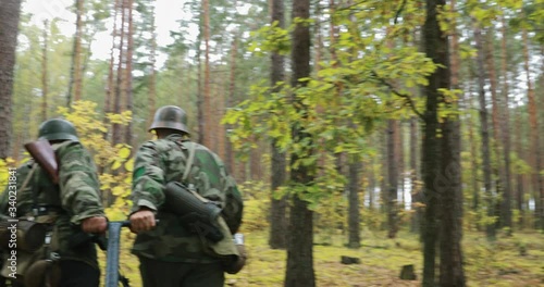 Wallpaper Mural Historical Re-enactment. Re-enactors Dressed Like German Wehrmacht Infantry Soldiers Of World War II Pulling The Cart In Forest. Military Ammunition. Infantry Cart Handcart Infanteriekarren Torontodigital.ca
