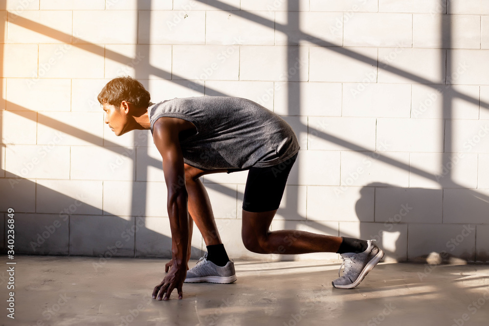 The man with runner on the street be running for exercise. The man with runner on the street be running for exercise.