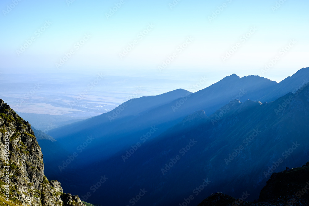 Sunrise on Fagaras high mountain ridge. Romanian mountain landscape with high peaks over 2200m