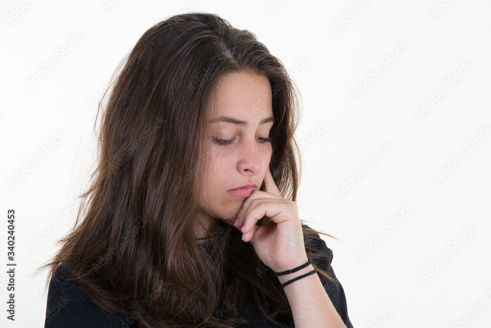 Young woman over isolated white background unhappy girl frustrated pensive Young woman over isolated white background unhappy girl frustrated pensive