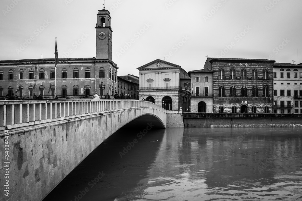 Black and white image of Ponte di Mezzo in Pisa over Arno river Tuscany, Italy