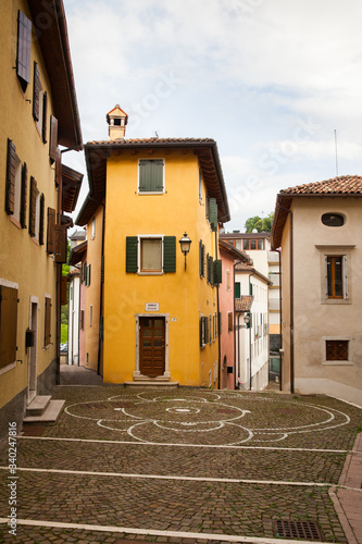 Obraz na plátně Old narrow street in historical part of Belluno, Veneto region, Italy