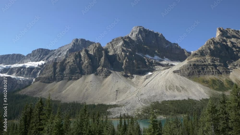 Canadian mountain landscape, with snow, pine forest, and glacier lake. Canadian mountain landscape, with snow, pine forest, and glacier lake.
