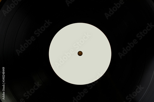 Close up shot of a black vinyl disk with white tag for mockup purposes