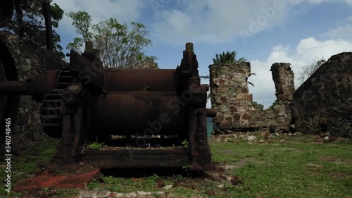 Historic abandoned factory with a giant water wheel in Tobago. photo