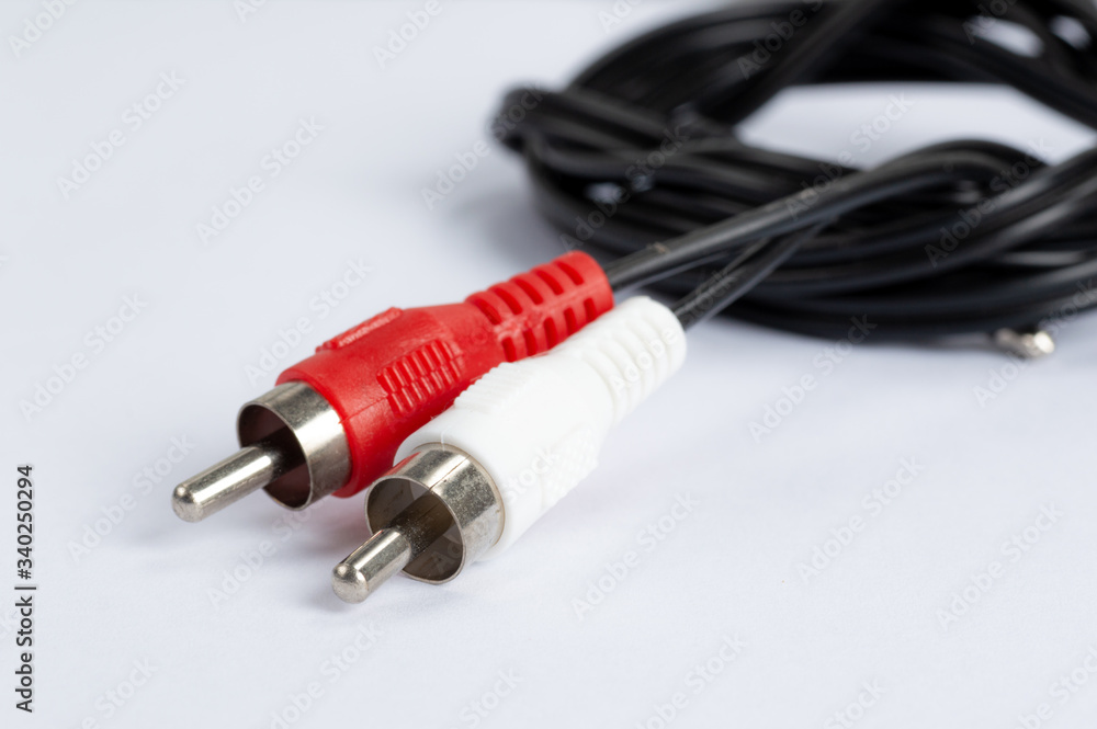 An audio cable against a white background An audio cable against a white background
