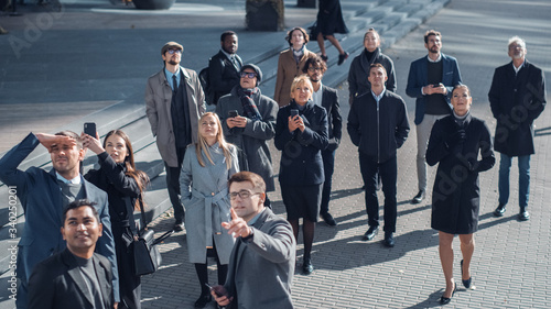 Fotografija Multicultural Diverse Office Managers and Business People Suddenly Stop on the Street and Look Up