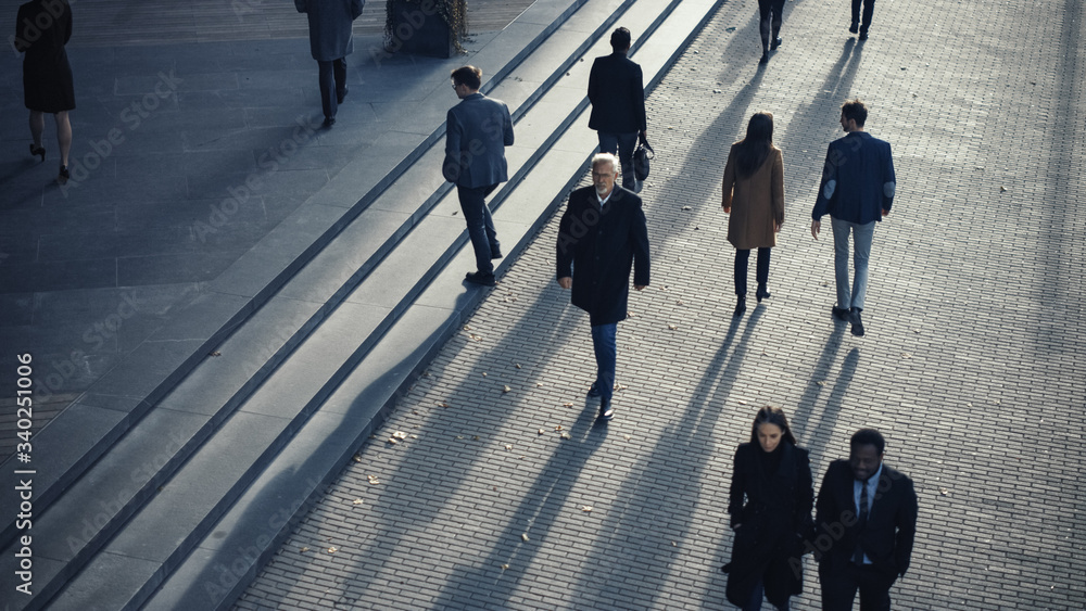 Obraz premium Office Managers and Business People Commute to Work in the Morning or from Office on a Sunny Day on Foot. Pedestrians are Dressed Smartly. Successful People Walking in Downtown. Shot from Above.