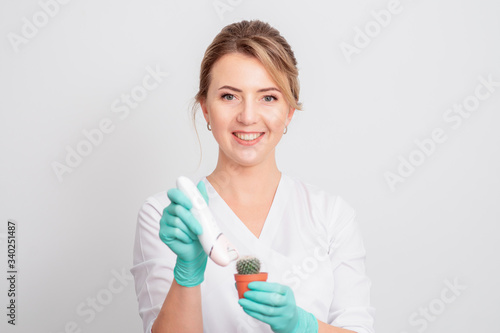 Woman shaves green cactus.