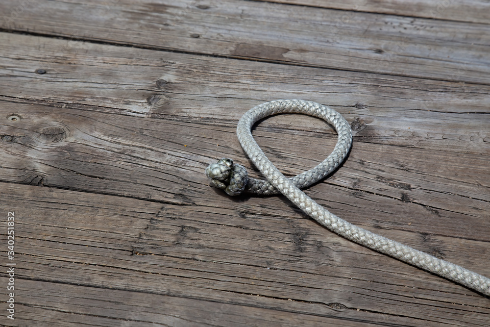 closeup of looped rope on timber pier near Kuranda in Tropical North Queensland, Australia