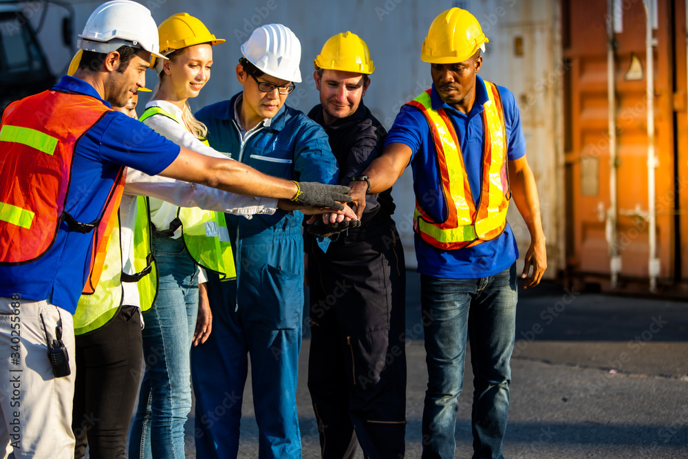 Professional engineering team join hands together and celebrating success. Business teamwork concept Professional engineering team join hands together and celebrating success. Business teamwork concept