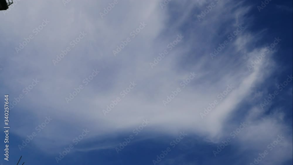 Timelapse moving white cloud with beautiful blue high sky background in day time, flying bird Timelapse moving white cloud with beautiful blue high sky background in day time, flying bird