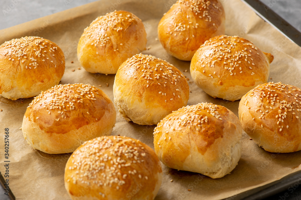 Homemade fresh bread buns with sesame seeds.