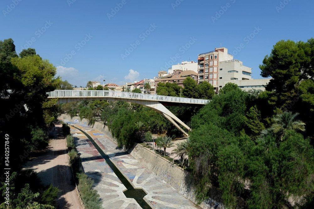 Pedestrian bridge to the Pasarela Del Mercado Market across the Vinalopo River in Elche. Spain