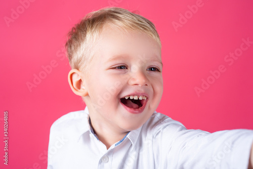 Cute boy, isolated. Portrait of a smiling boy. Funny little boy. 4-5 years old. photo