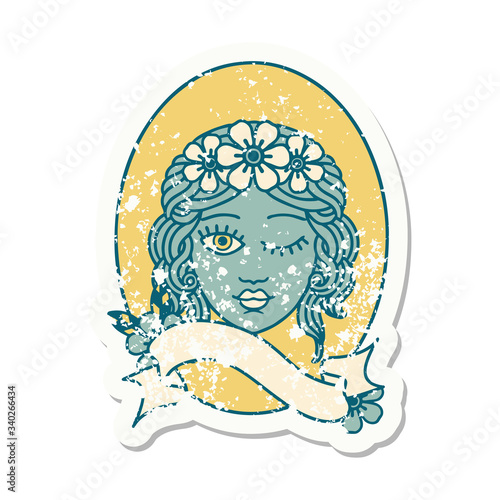 grunge sticker with banner of a maiden with crown of flowers winking