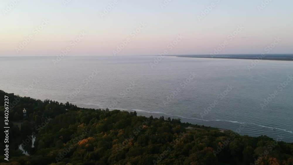 Aerial view. Beautiful wide river. Dense green trees. Overcast sky. Drone.
Aerial view. Beautiful wide river. Dense green trees. Overcast sky. Drone.