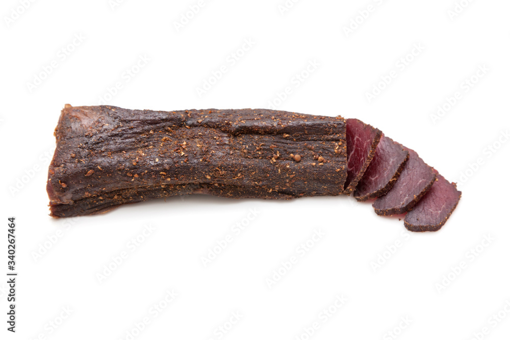 Beef Biltong, South African Beef Jerky isolated on a white studio background. Beef Biltong, South African Beef Jerky isolated on a white studio background.