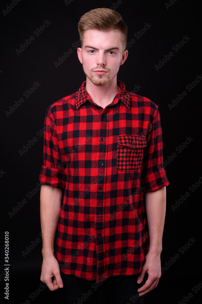 Obraz premium Portrait of young handsome blond bearded hipster man