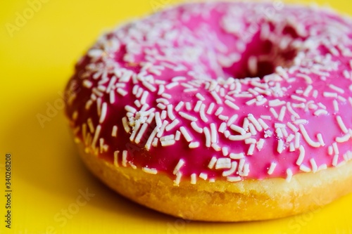 pink donut with sprinkles pop art style 