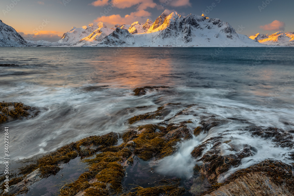 Soft tones of the golden hour in mountains at the coast of Vareid, Lofoten, Norway
Soft tones of the golden hour in mountains at the coast of Vareid, Lofoten, Norway