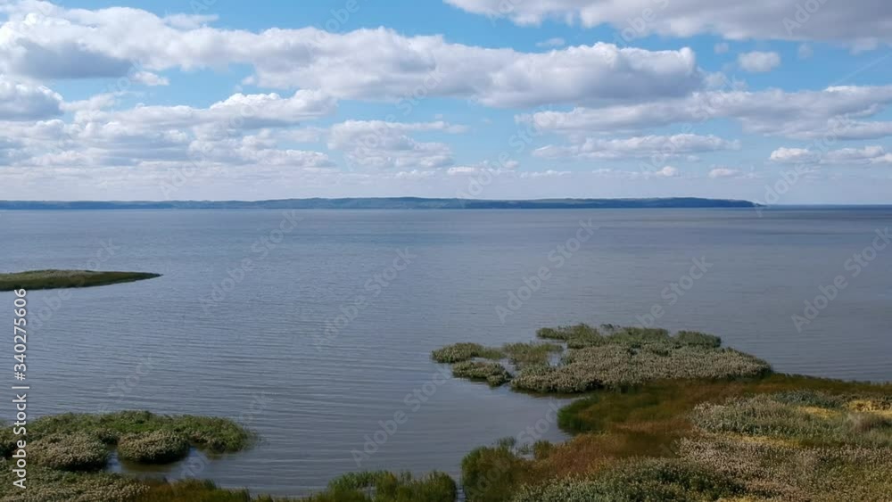 Aerial view. Beautiful wide river. Dense green trees. Cloudy sky. Scenic view. Drone. Aerial view. Beautiful wide river. Dense green trees. Cloudy sky. Scenic view. Drone.