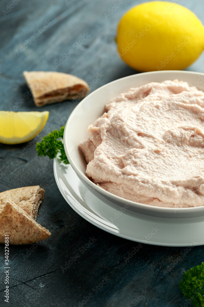 Taramasalata dip made with fish roe in white bowl Taramasalata dip made with fish roe in white bowl