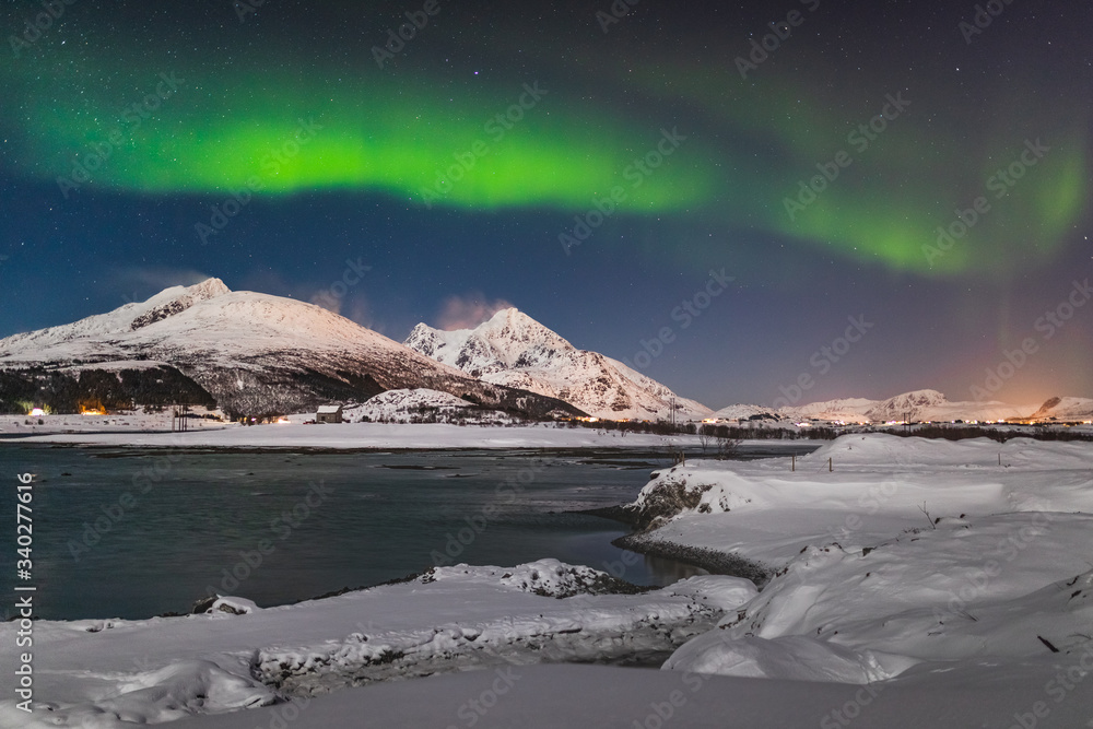 Amazing Aurora Borealis  during a cold arctic night on Lofoten Islands archipelago in winter, Norway, Scandinavia