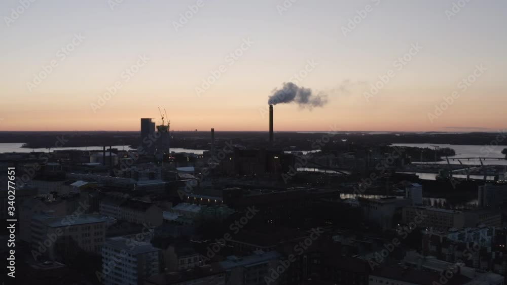 Aerial drone view of city and industrial chimney exhaust smoke and steam. Air Pollution. Aerial drone view of city and industrial chimney exhaust smoke and steam. Air Pollution.